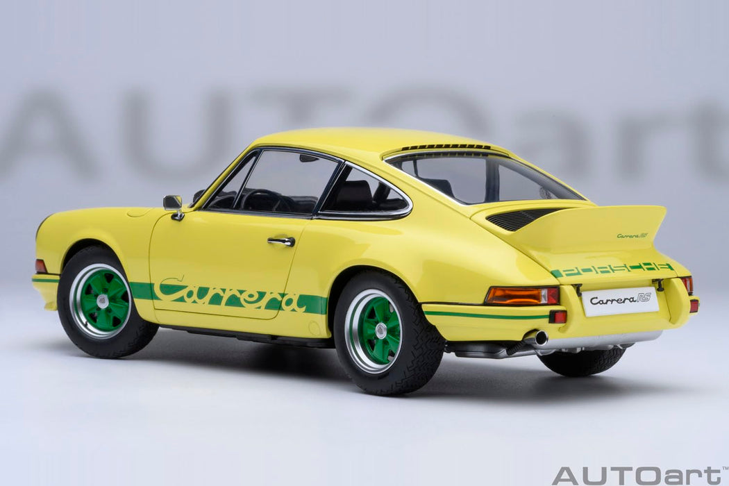 Modèle réduit 1/18 de la Porsche 911 Carrera 2.7 RS Autoart, couleur jaune clair avec bandes vertes.
